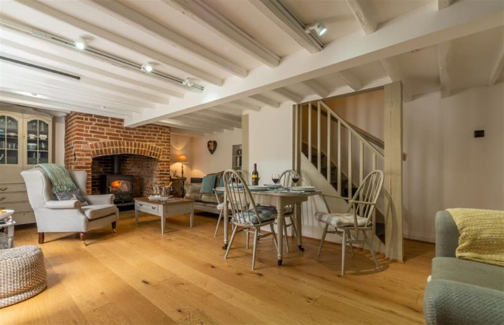 Ground floor: Open-plan living area with stairs leading to the first floor at Sextons Yard Cottage, Docking near Kings Lynn