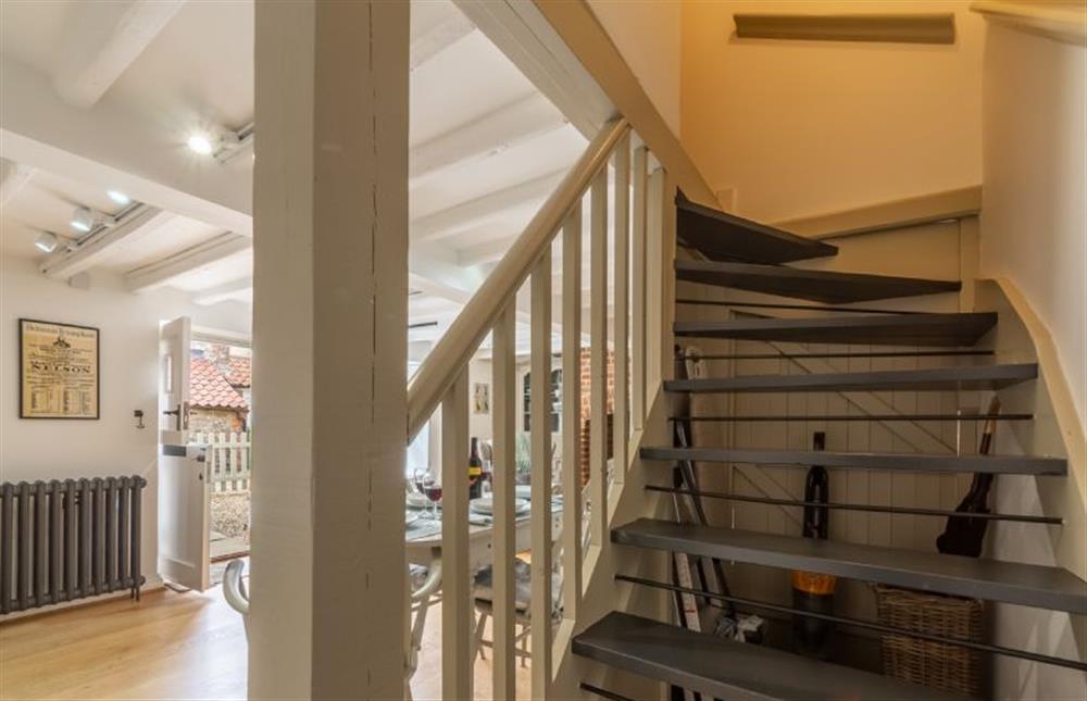 Ground floor: Open tread stairs leading to the first floor at Sextons Yard Cottage, Docking near Kings Lynn