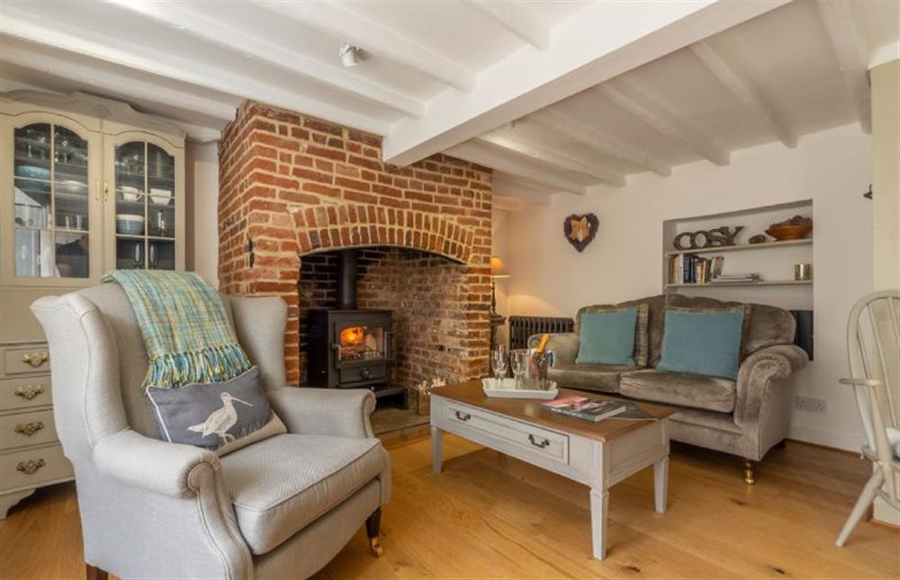Ground floor: Sitting area with cosy multi-fuel burning stove at Sextons Yard Cottage, Docking near Kings Lynn