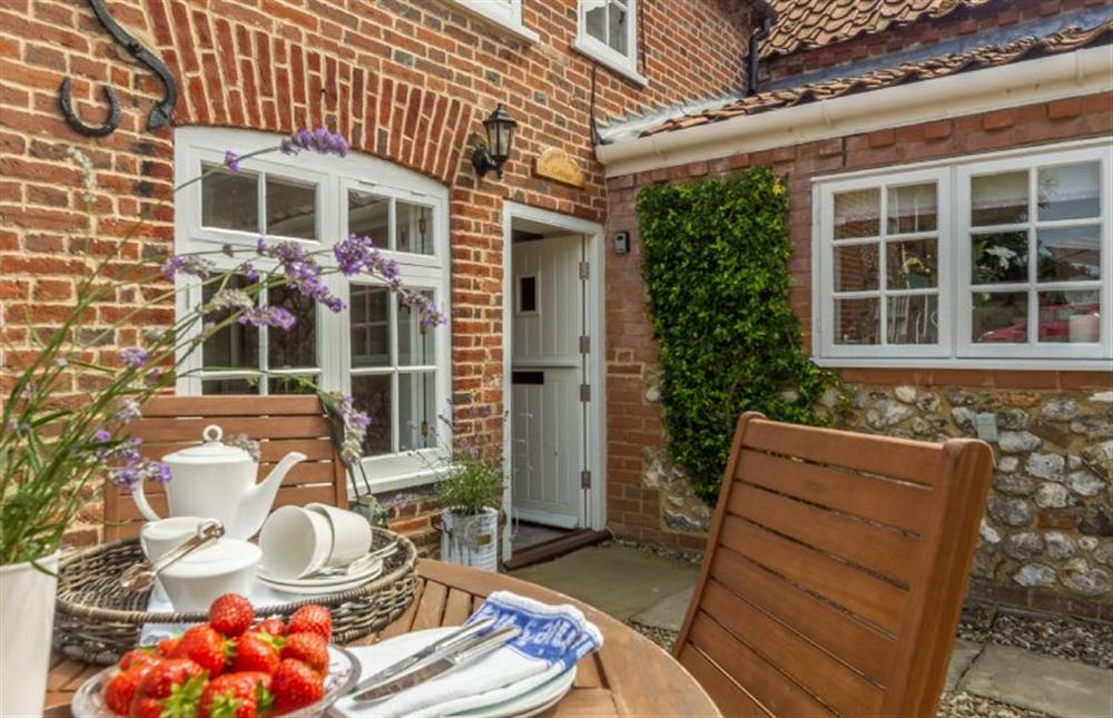 If the weather permits, dine al fresco in the sunny front garden at Sextons Yard Cottage, Docking near Kings Lynn