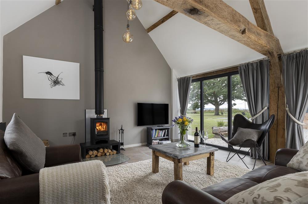 Ground floor: Sitting room with wood burning stove and beautiful views at Shakespears Shoes, Dunnington