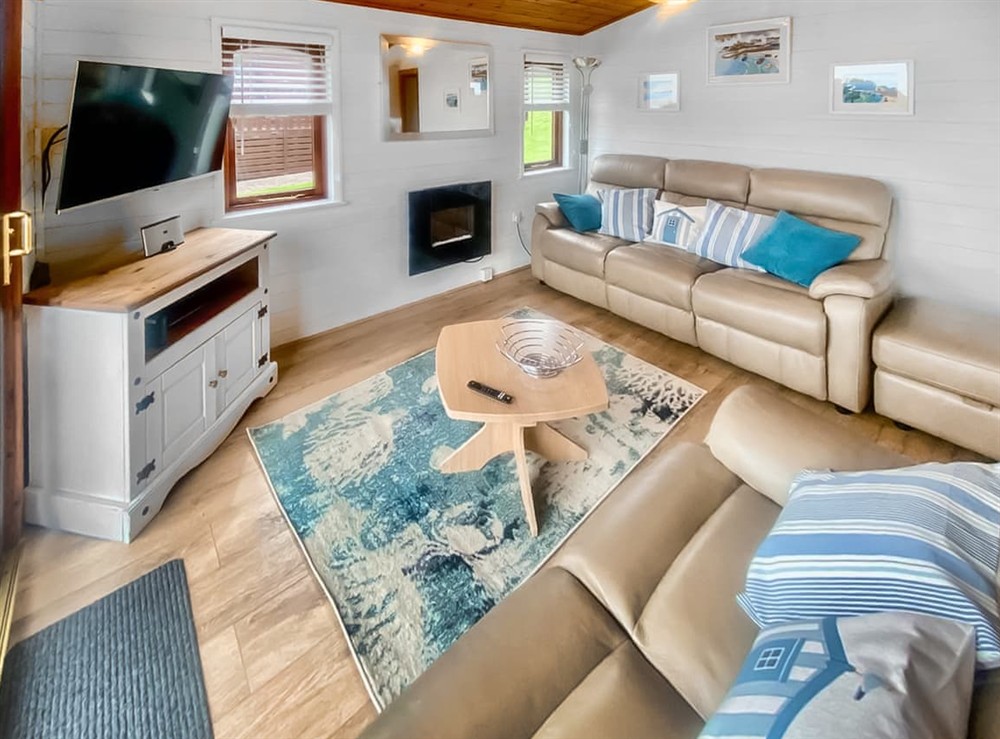 Open plan living space at Waterwynch Monarch Plus Lodge, 
