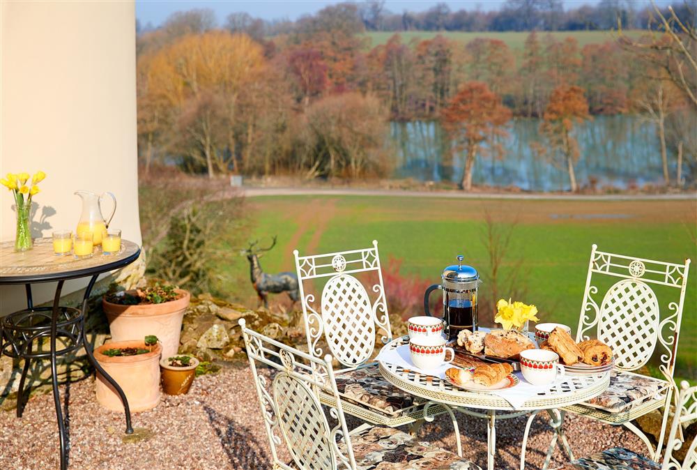 Admire the lake and grounds from this perfect spot on the terrace at Sham Castle, Acton Burnell