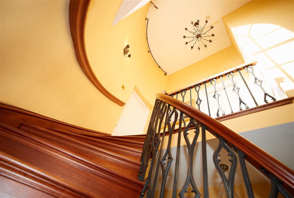 Beautiful spiral staircase leading to the first floor