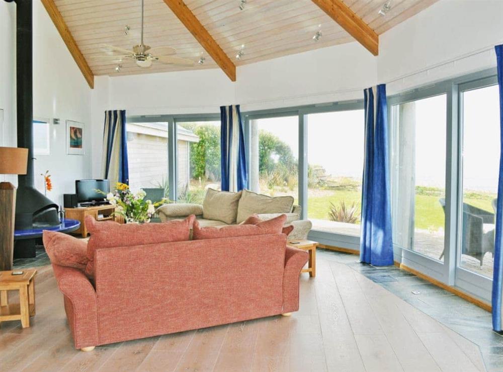 Fabulous open plan living space leading onto decked terrace at Shark’s Fin in Sennen, S. Cornwall., Great Britain
