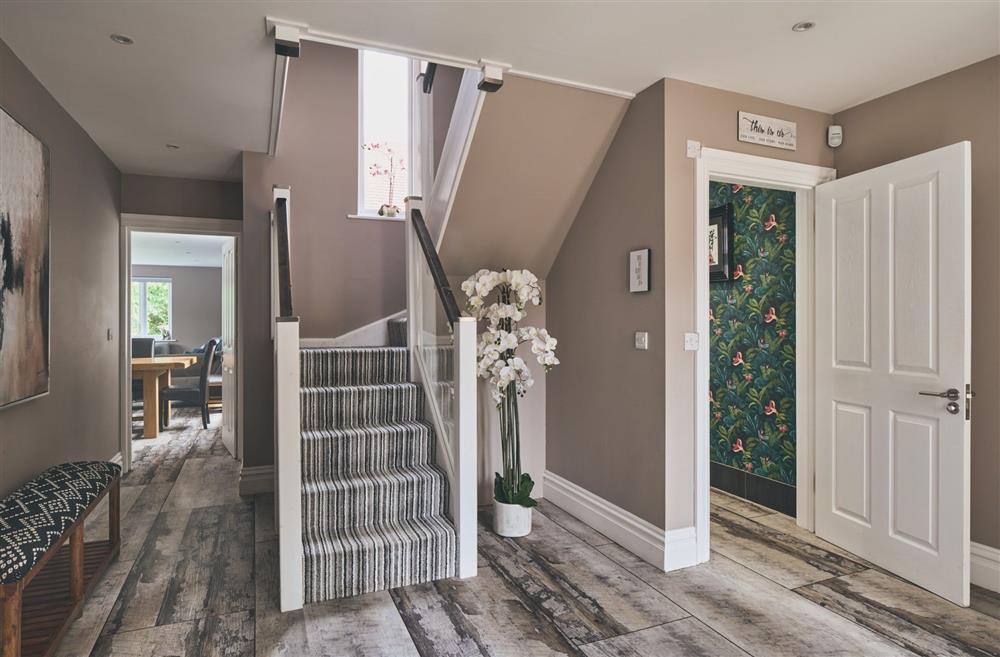 The entrance hall with a WC leading to the open-plan living space