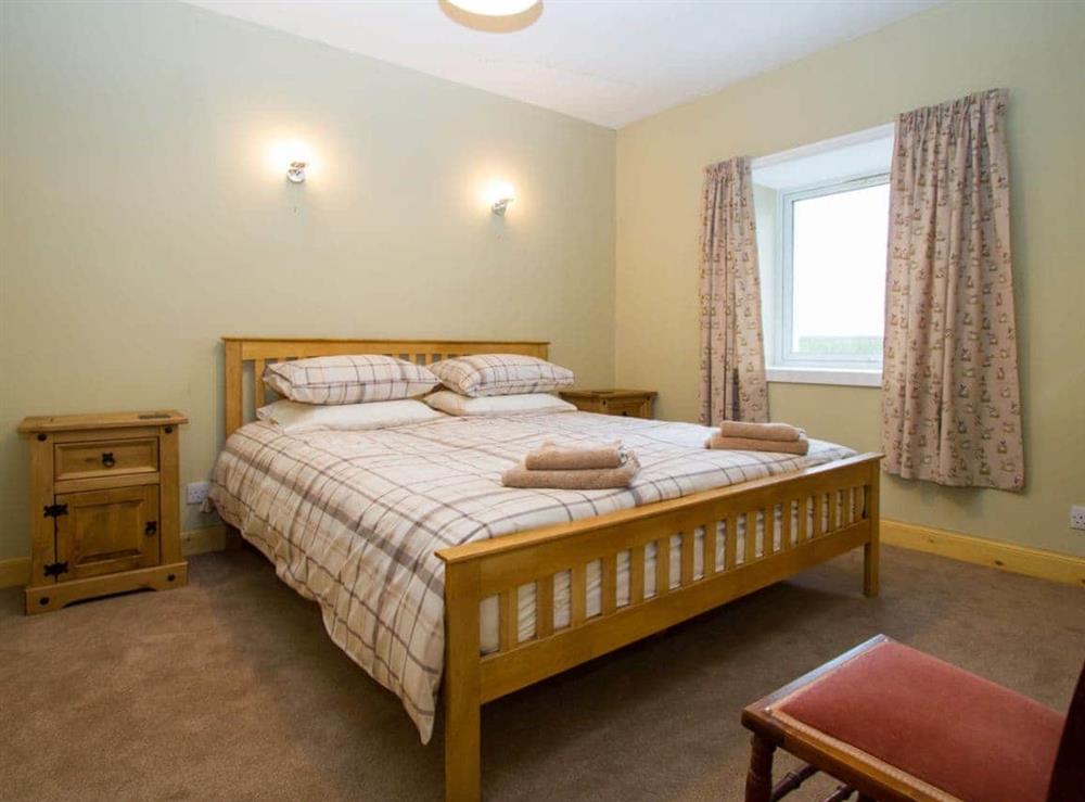 Double bedroom with superkingsize bed at Sheaf Dale in Portmahomack, near Tain, Northern Highlands, Ross-Shire