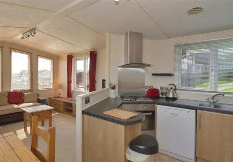 Living room and kitchen in the Foxes Run 12 at Shearbarn Holiday Park in Hastings, East Sussex