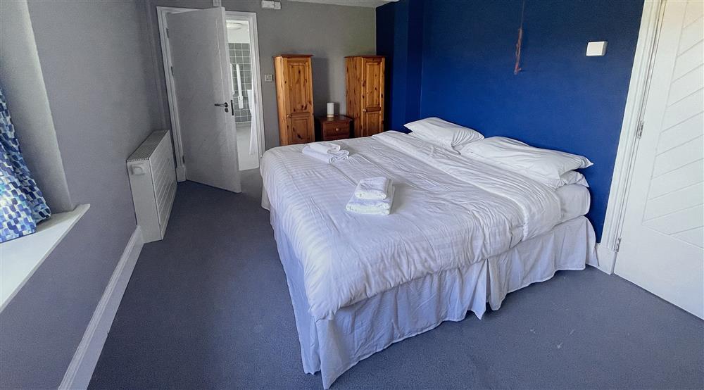 One of the double bedrooms at Shearwater Group House in Pembroke, Pembrokeshire