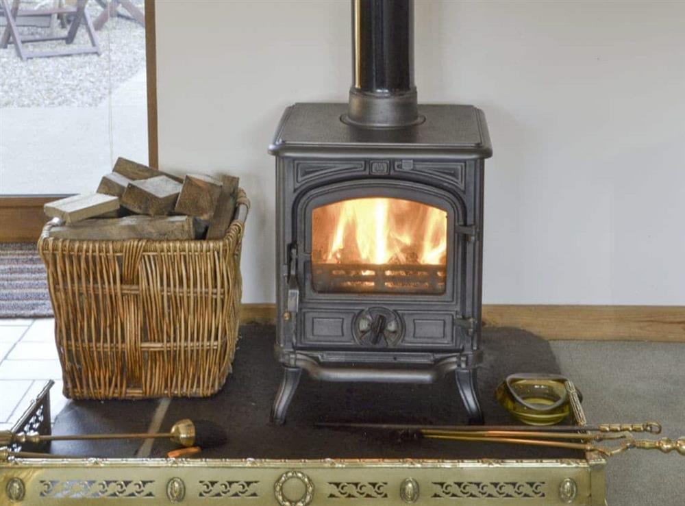 Welcoming wood burner at Shedend in Nether Dallachy, near Spey Bay, Morayshire