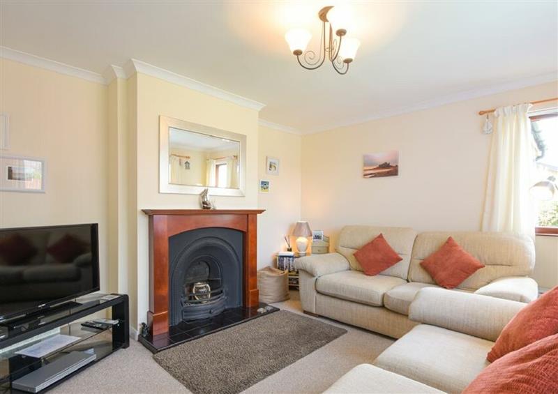 Enjoy the living room at Shell Cottage, Embleton