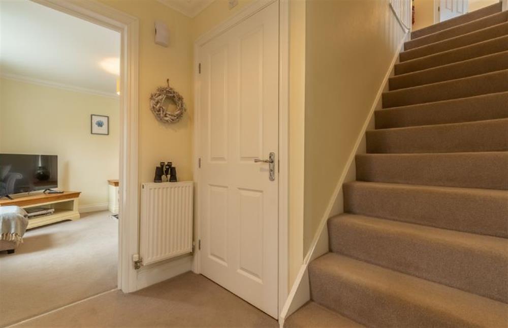 Ground floor: Hallway with cloakroom and stairs to the first floor at Shellseekers, Snettisham near Kings Lynn