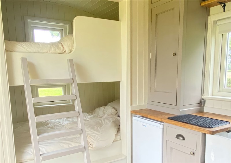 A bedroom in Shepherds Hut 2 at Shepherds Hut 2, Northchapel