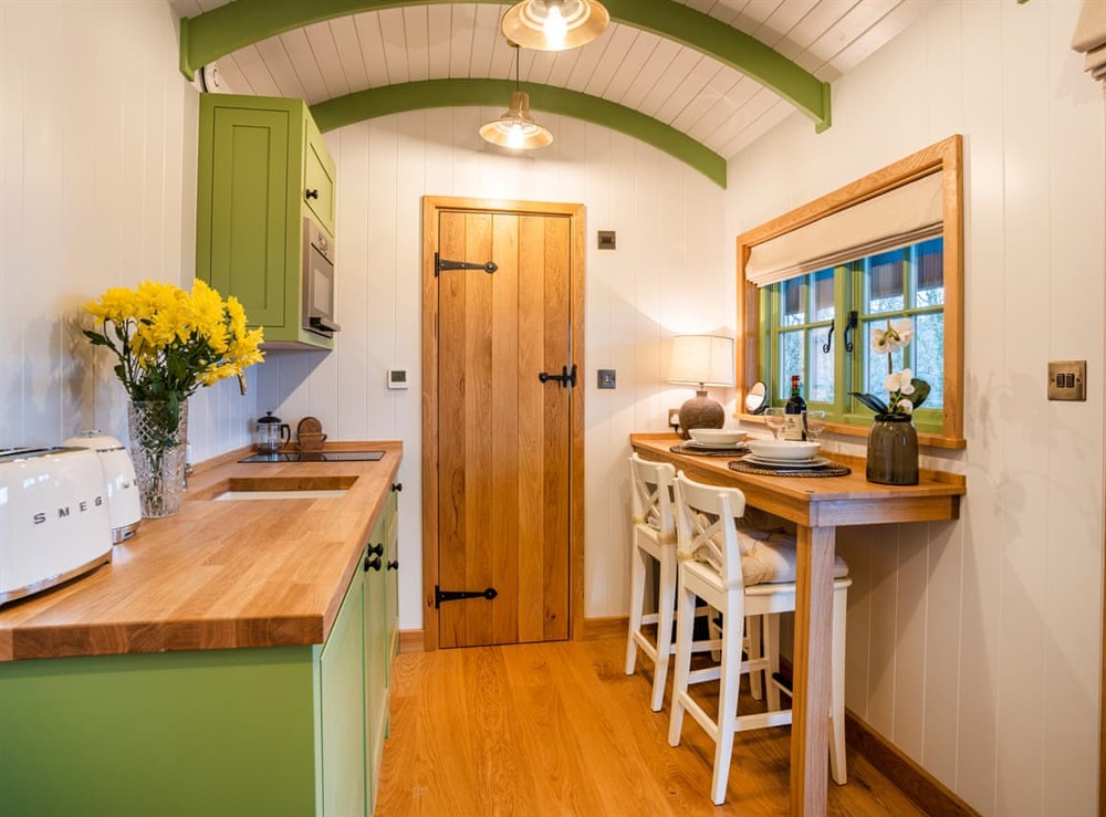 Open plan living space at Shepherds Hut at Northcombe Farm in Beaworthy, Devon