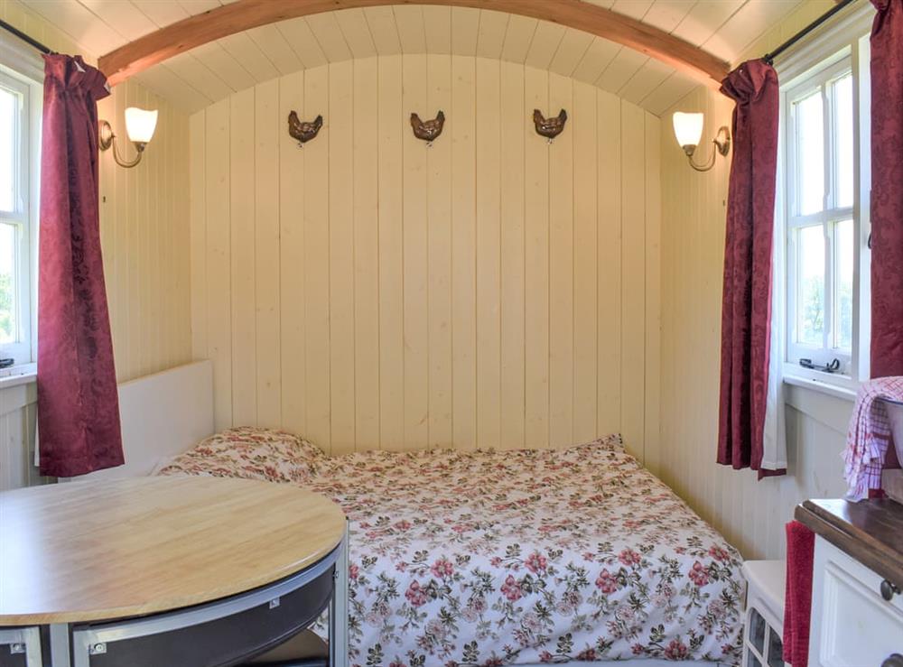 Open plan living space at Shepherds Hut in Harpford, near Sidmouth, Devon