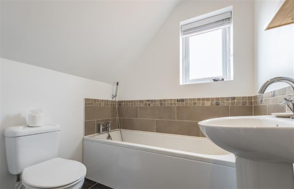 Bathroom with bath and hand-held shower at Sherborne House, Wells-next-the-Sea