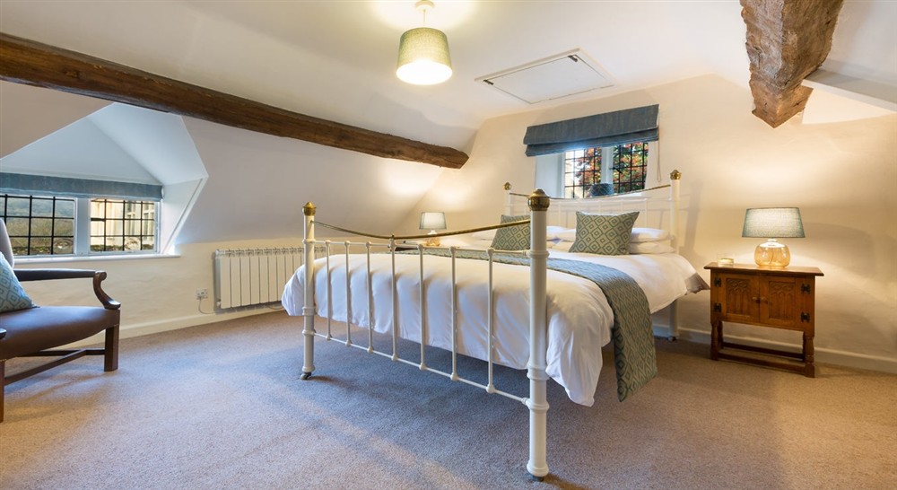 The king-size bedroom at Sherborne West Lodge in Sherborne, Gloucestershire