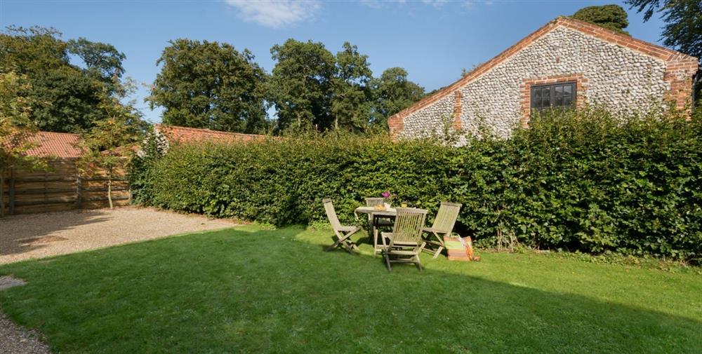 The large garden and seating area at Sheringham Wood Farm in Upper Sheringham, Norfolk