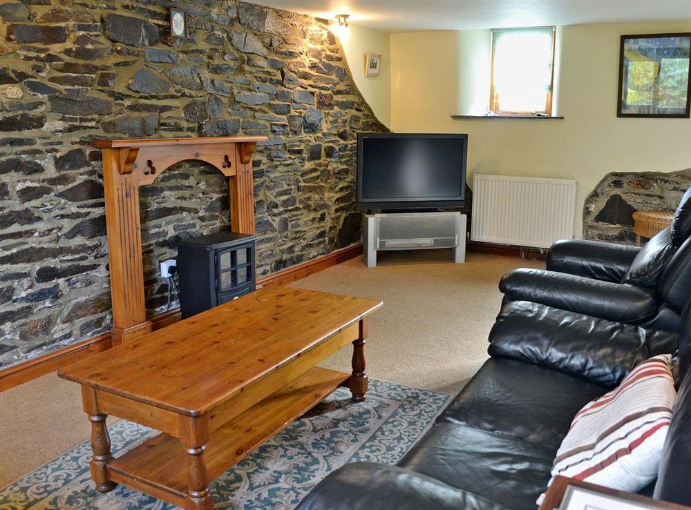 Charmingly furnished living room with electric wood burner (photo 2) at Coriander, 