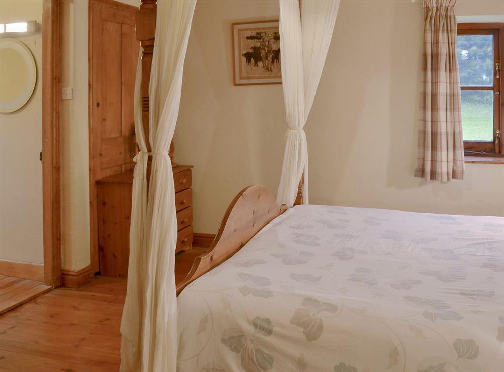 Comfortable four poster bedroom at Sherrill Farmhouse, 