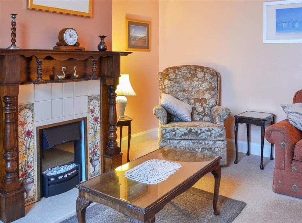 Warm and cosy living room at Shingle Cottage in Seascale, near Eskdale, Cumbria