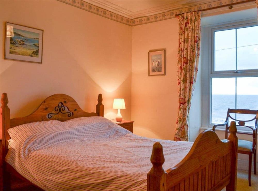 Warm and inviting double bedroom at Shingle Cottage in Seascale, near Eskdale, Cumbria