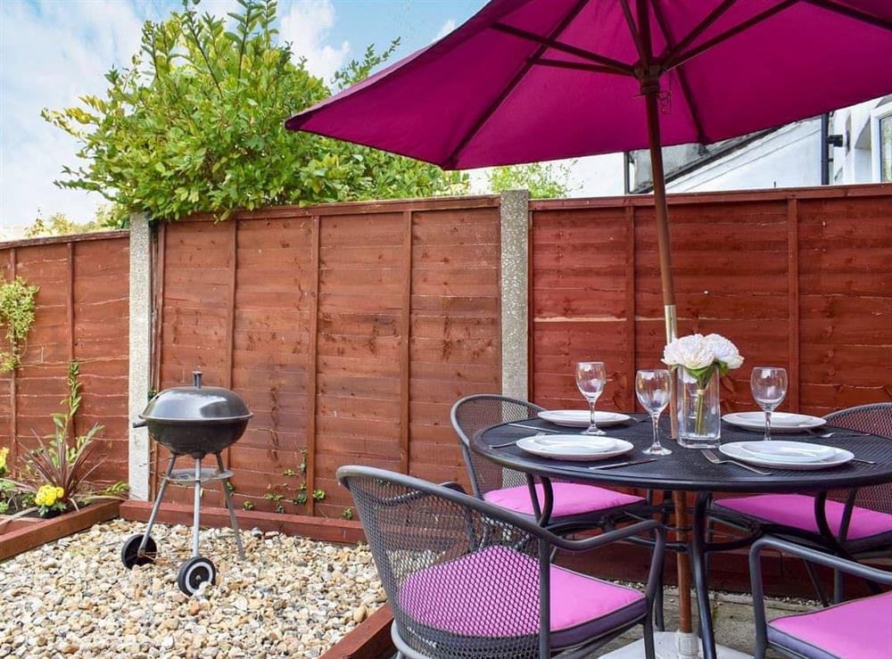 Terrace with furnitureand BBQ at Shingle Cottage in Whistable, Kent