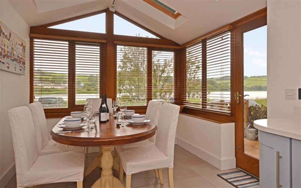 The dining area overlooking the fresh water Ley and nature reserve. at Shingle House in Torcross