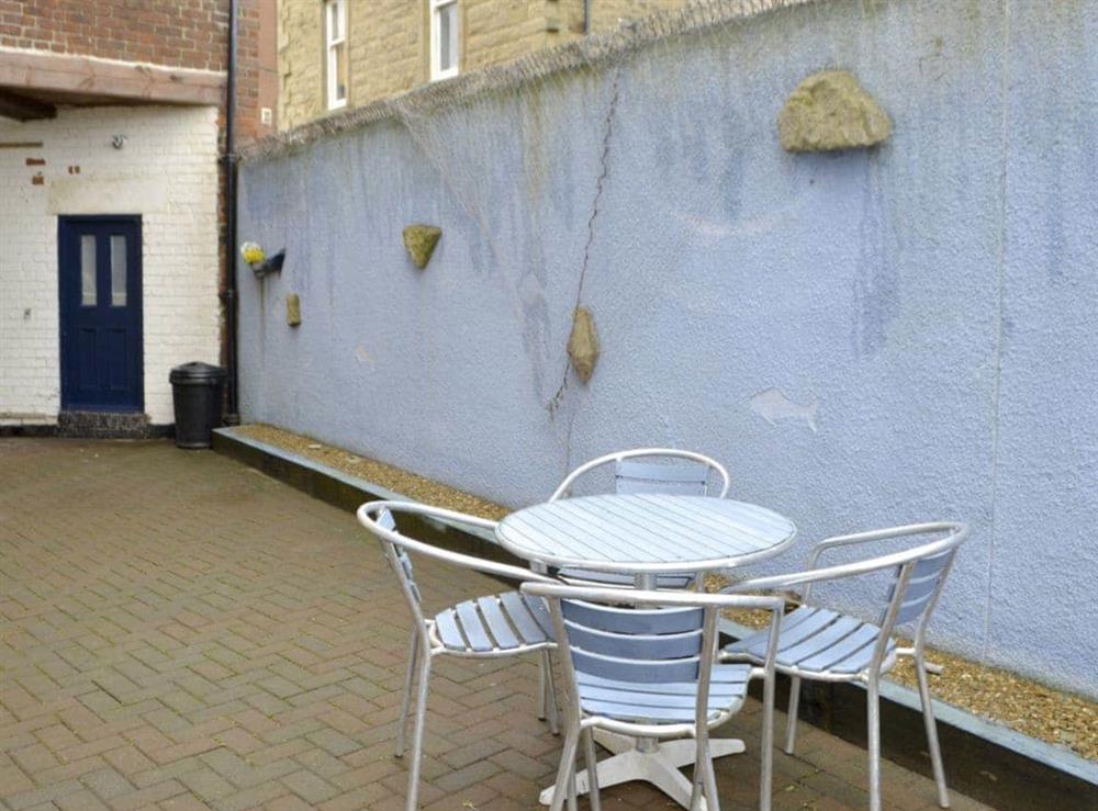 Enclosed rear courtyard with sitting out area