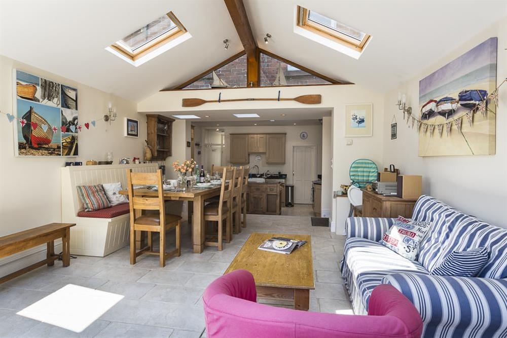 Dining area with doors leading to patio area and garden at Shipwrights in 11 Coronation Road, Salcombe