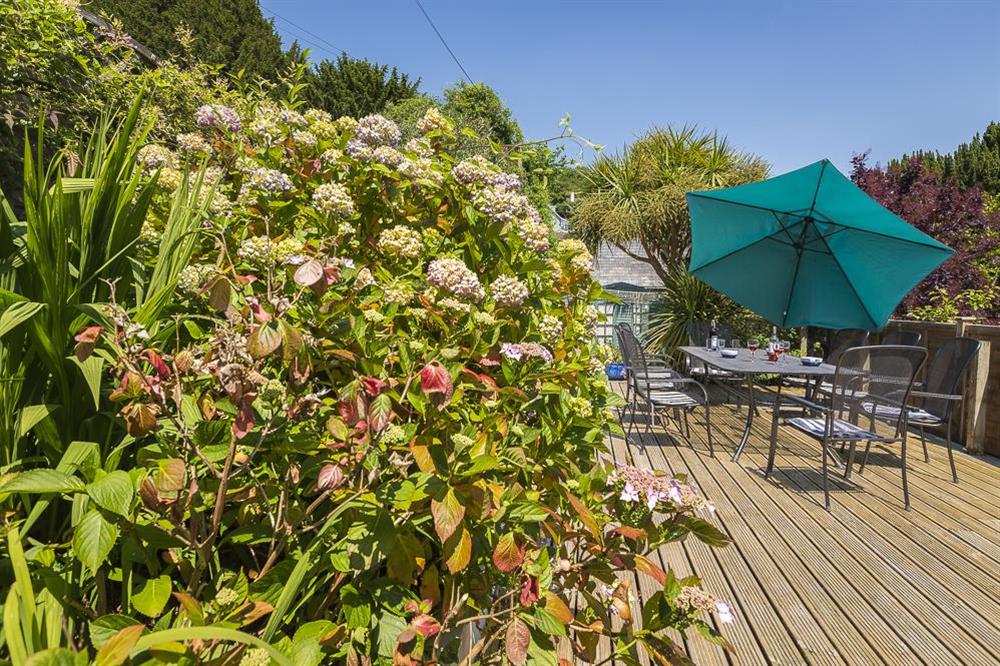 Good sized area of wooden decking with table and chairs (photo 3) at Shipwrights in 11 Coronation Road, Salcombe