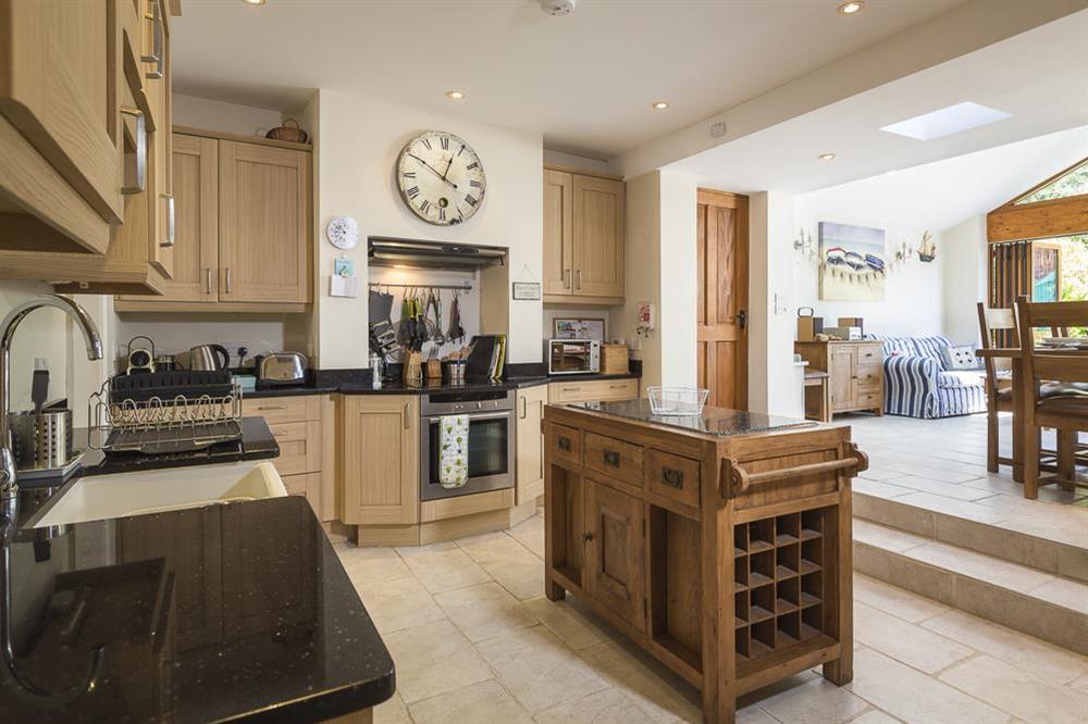 Open plan area with modern kitchen at Shipwrights in 11 Coronation Road, Salcombe