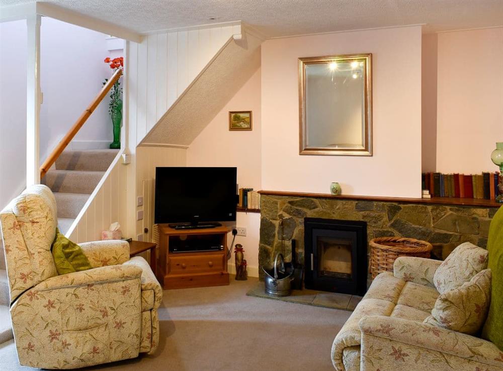 Comfortable living room with multi-fuel burner at Shirleys Cottage in Middlezoy, near Bridgwater, Somerset
