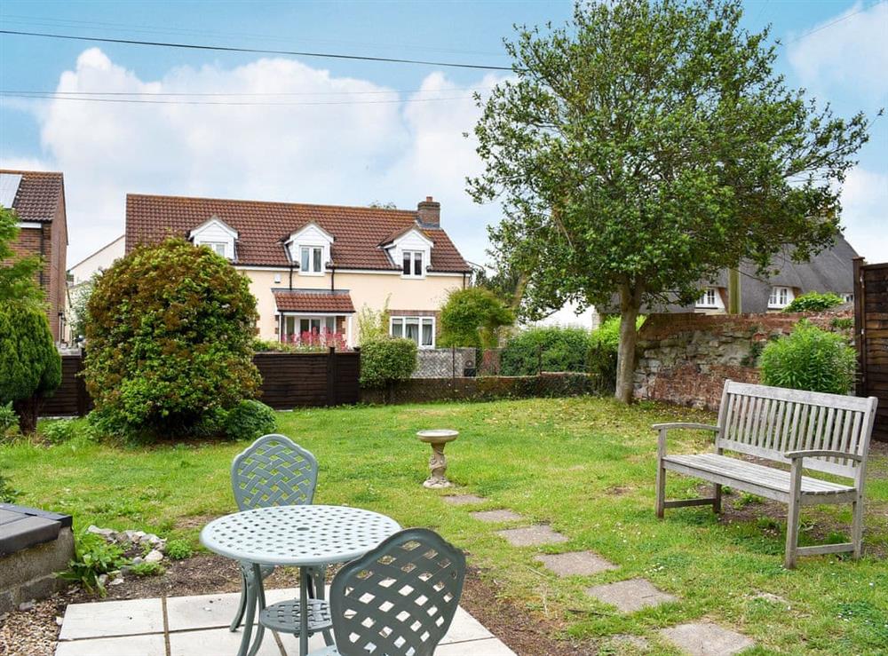 Large enclosed garden with patio, garden furniture and BBQ at Shirleys Cottage in Middlezoy, near Bridgwater, Somerset
