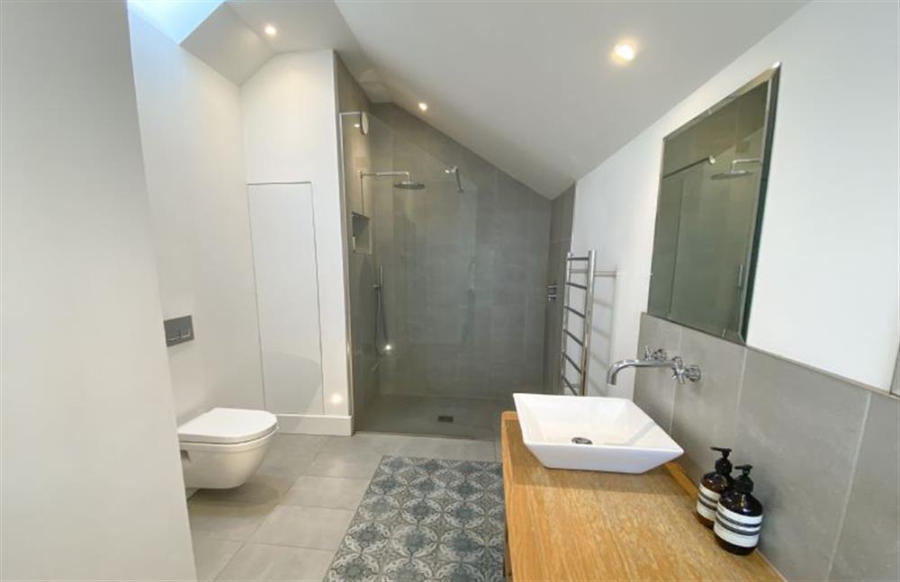 Bedroom one’s en-suite shower room at Shore Edge, Portreath