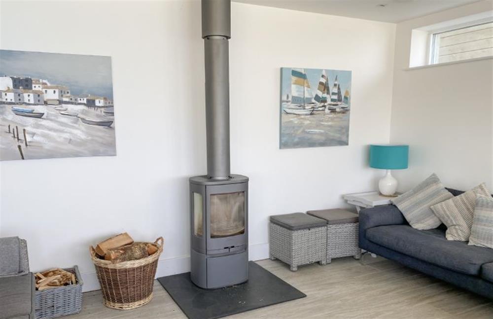 Warm up by the wood burning stove at Shore Edge, Portreath