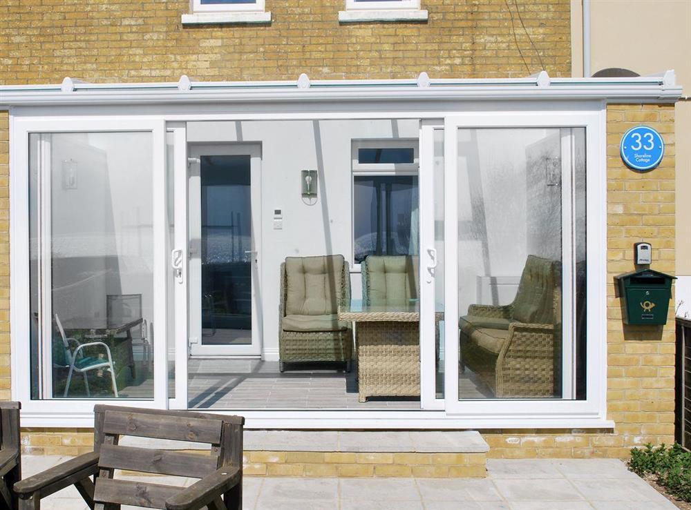 Holiday property with conservatory at Shoreline Cottage in Sandown, Isle Of Wight