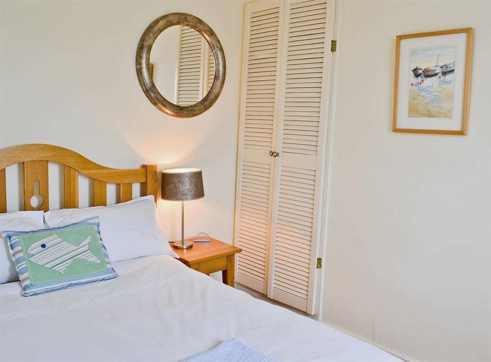 Comfortable double bed with stunning views over the estuary at Shorewaters in Appledore, near Bideford, Devon