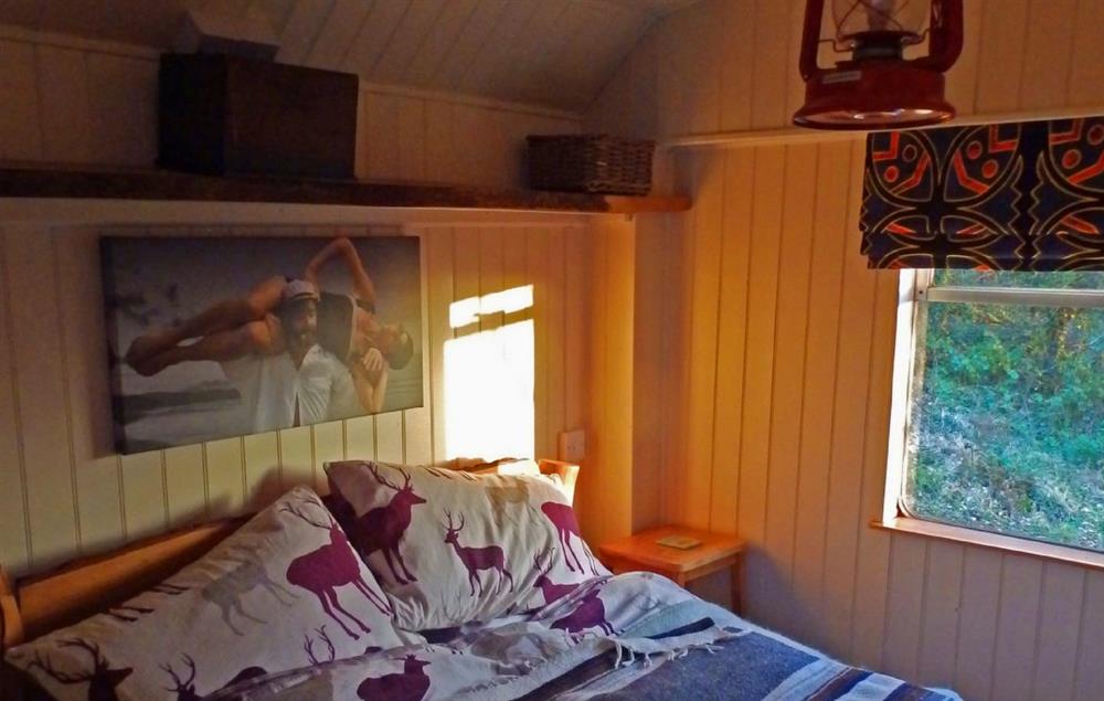 Bedroom with 4’6 bed  at Showmans Wagon, Taicynhaeaf