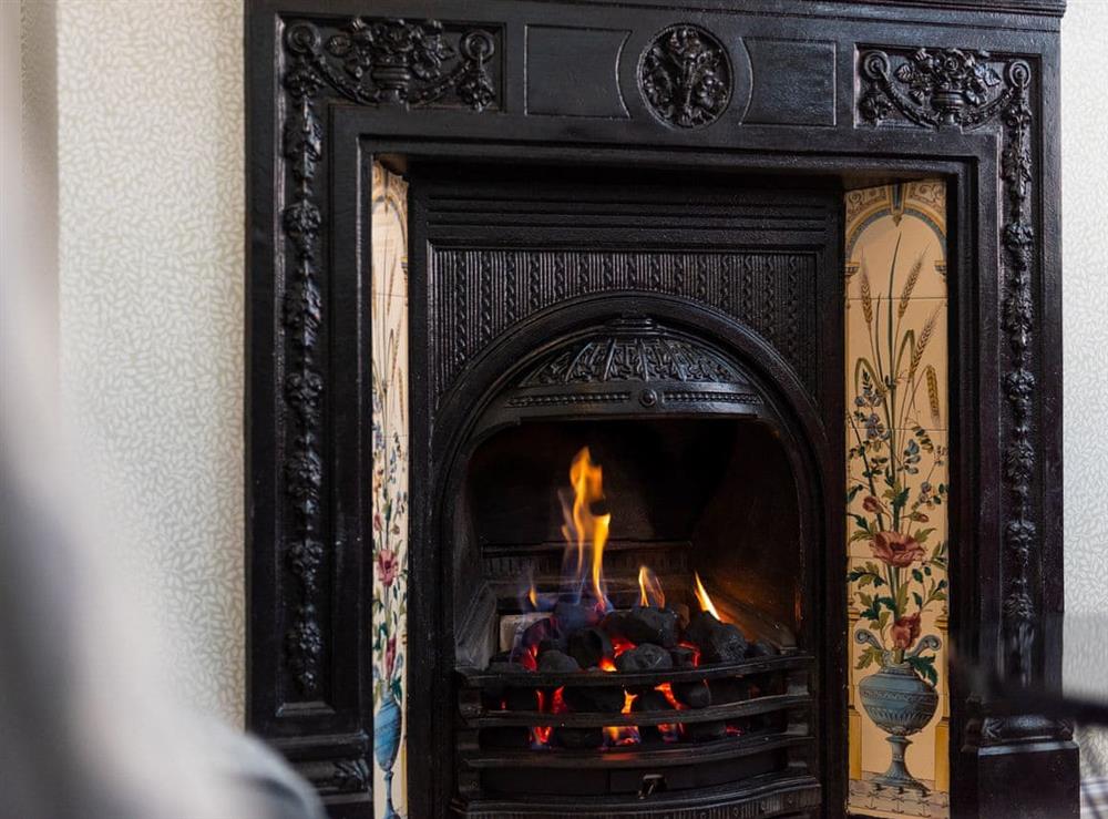 Relax by the fire in the lovely living room at Shrewsbury Fields in Shifnal, Shropshire