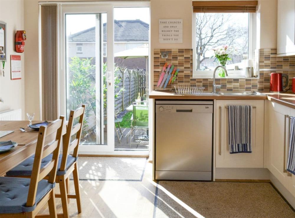 Airy kitchen/diner with patio door to garden at Signals Court in Scarborough, North Yorkshire