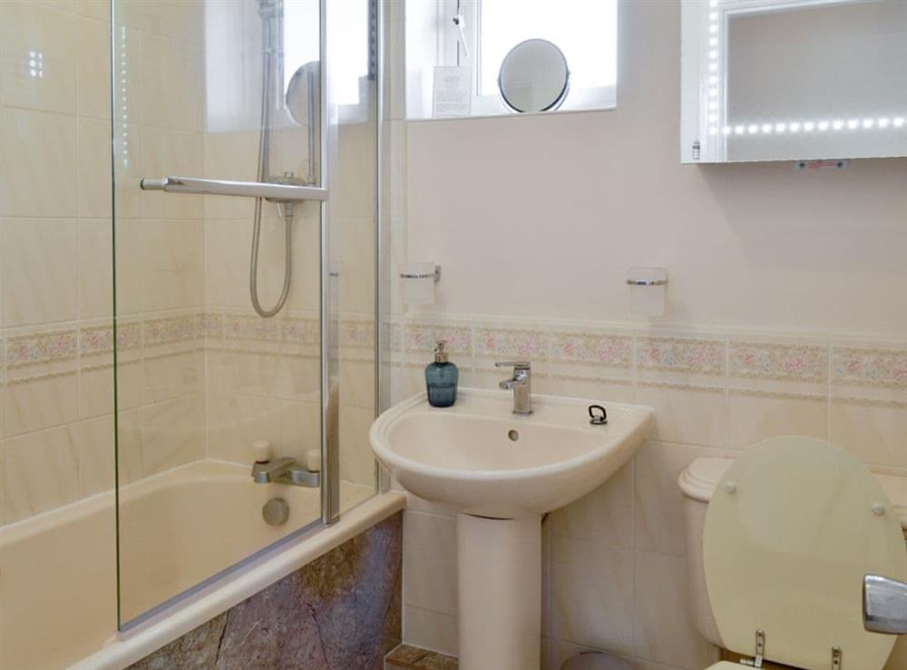 Family bathroom with shower over bath at Signals Court in Scarborough, North Yorkshire