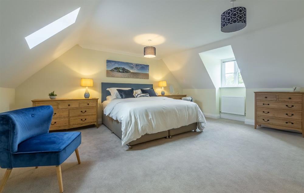 Bedroom three with 6’ super king bed and en-suite shower room. at Silver Birches, Holt