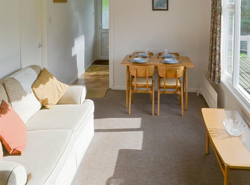 Light and airy living room with dining area at Silver Birches in Horning, Norfolk