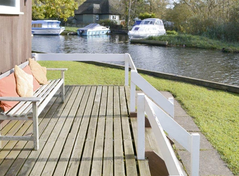 Raised decking wit outdoor seating at Silver Birches in Horning, Norfolk
