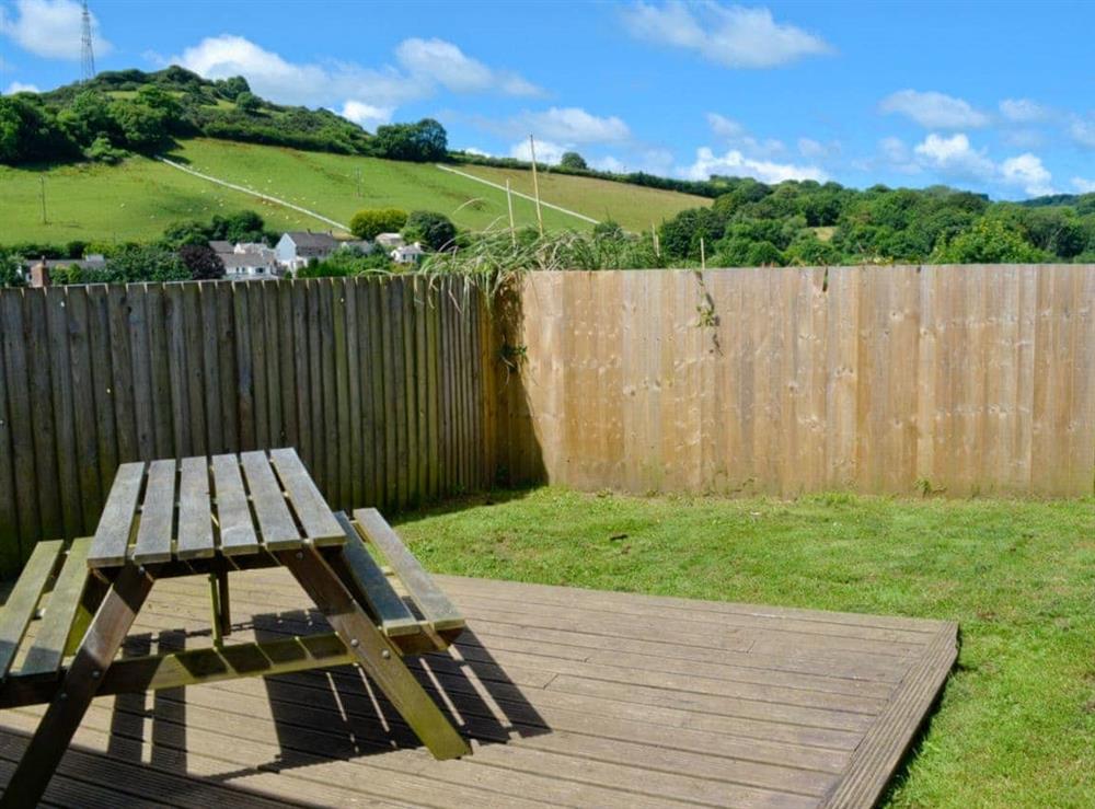 Garden with sitting out area and views of the surrounding countryside at Silver Cottage in Combe Martin, near Ilfracombe, Devon