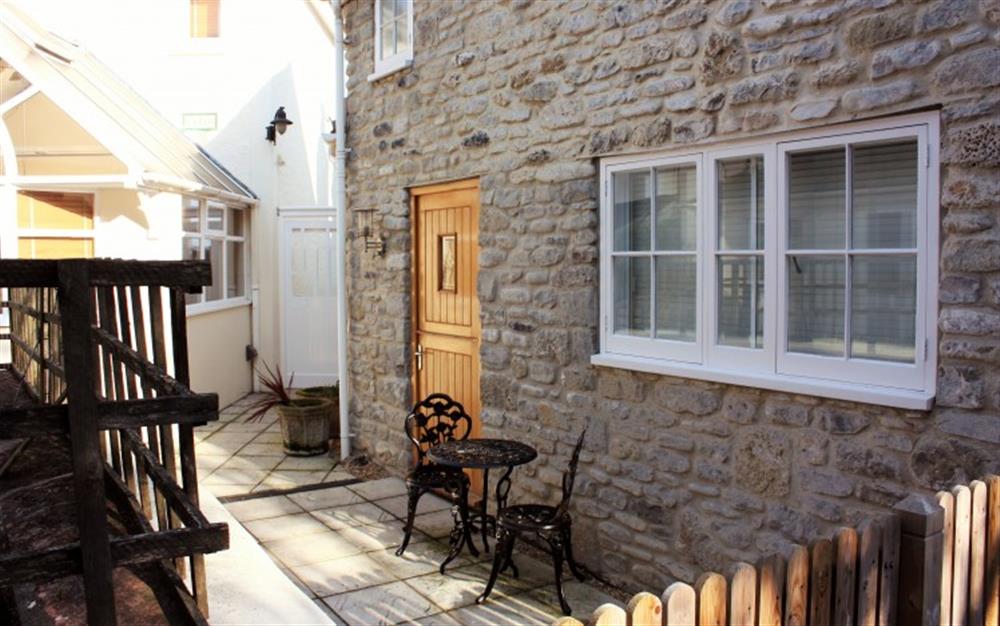 Outside seating area at Silver Street Cottage in Lyme Regis