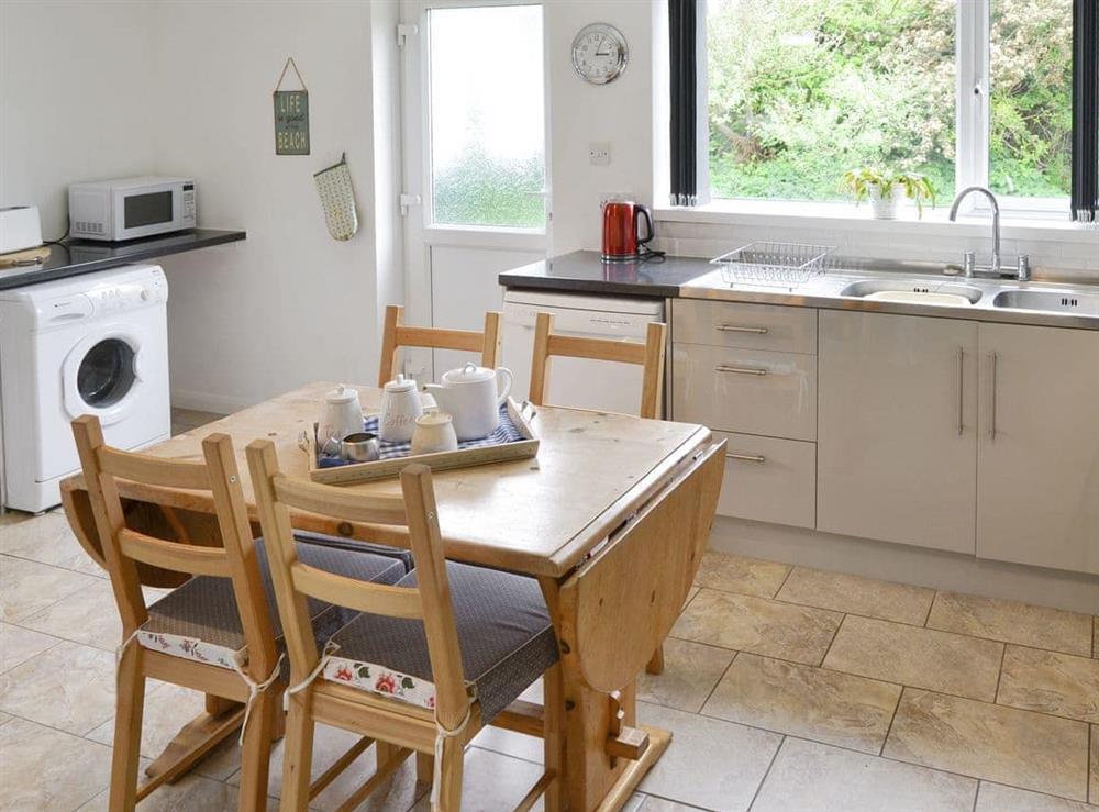 Well-equipped fitted kitchen with dining area at Silverdale in Bacton, near Happisburgh, Norfolk