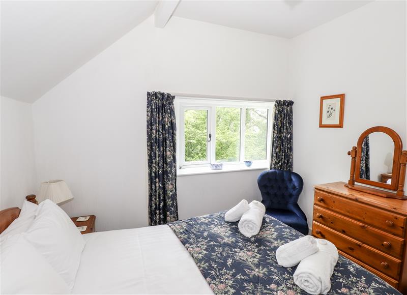 A bedroom in Silverthwaite Cottage at Silverthwaite Cottage, Skelwith Bridge near Elterwater