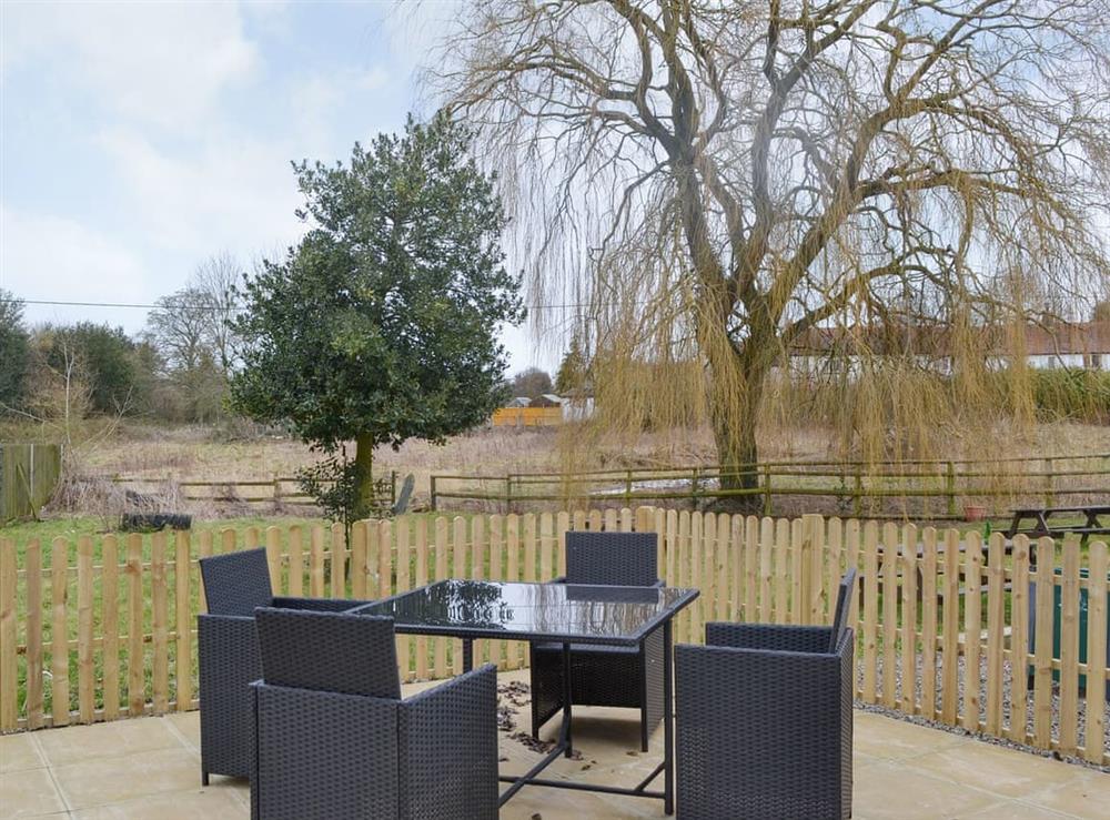 Enclosed patio area with outdoor furniture at No. 1 Ash Cottage, 